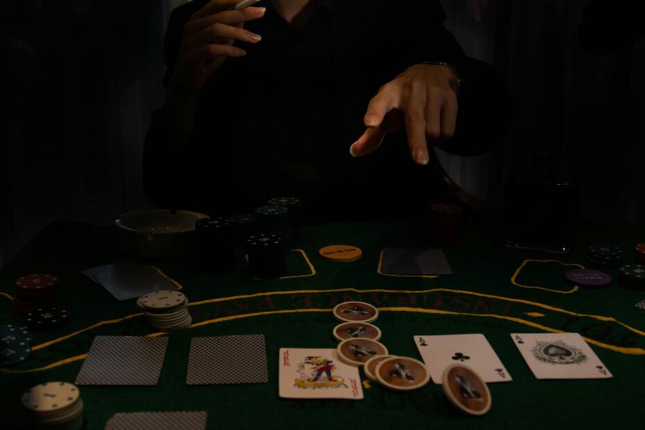 Player sitting at a poker table with cards and chips