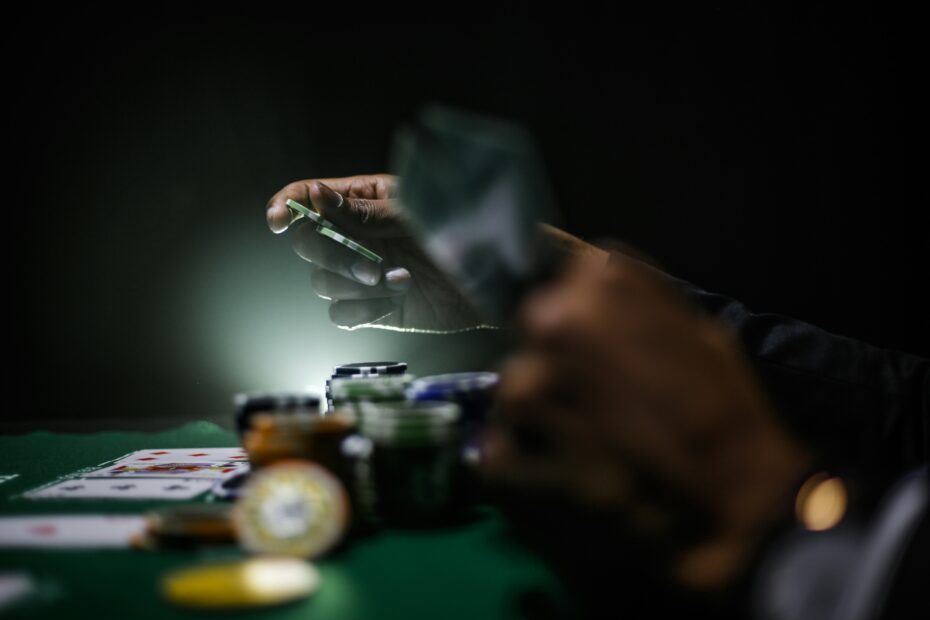 Playing cards and poker chips laid out on a felt table