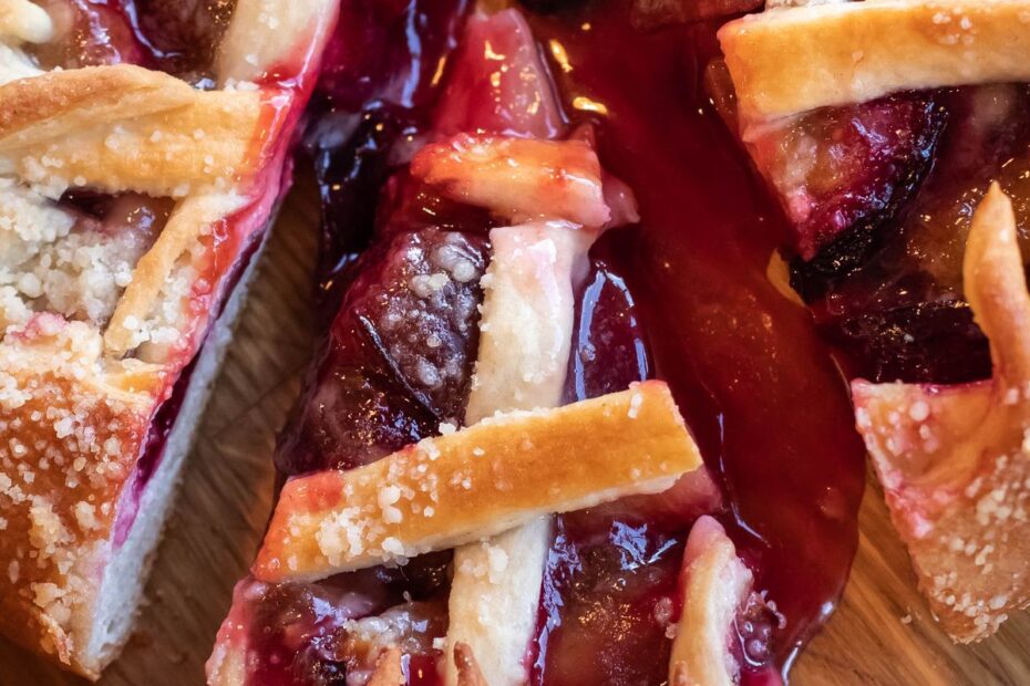 Close-up of a lattice-topped berry pie with a slice taken out, a picture of the cut a poker room takes from each pot